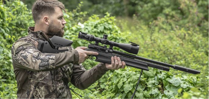 Man holding Air Arms Ultimate Sporter