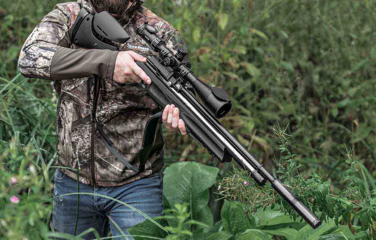 man holding air rifle