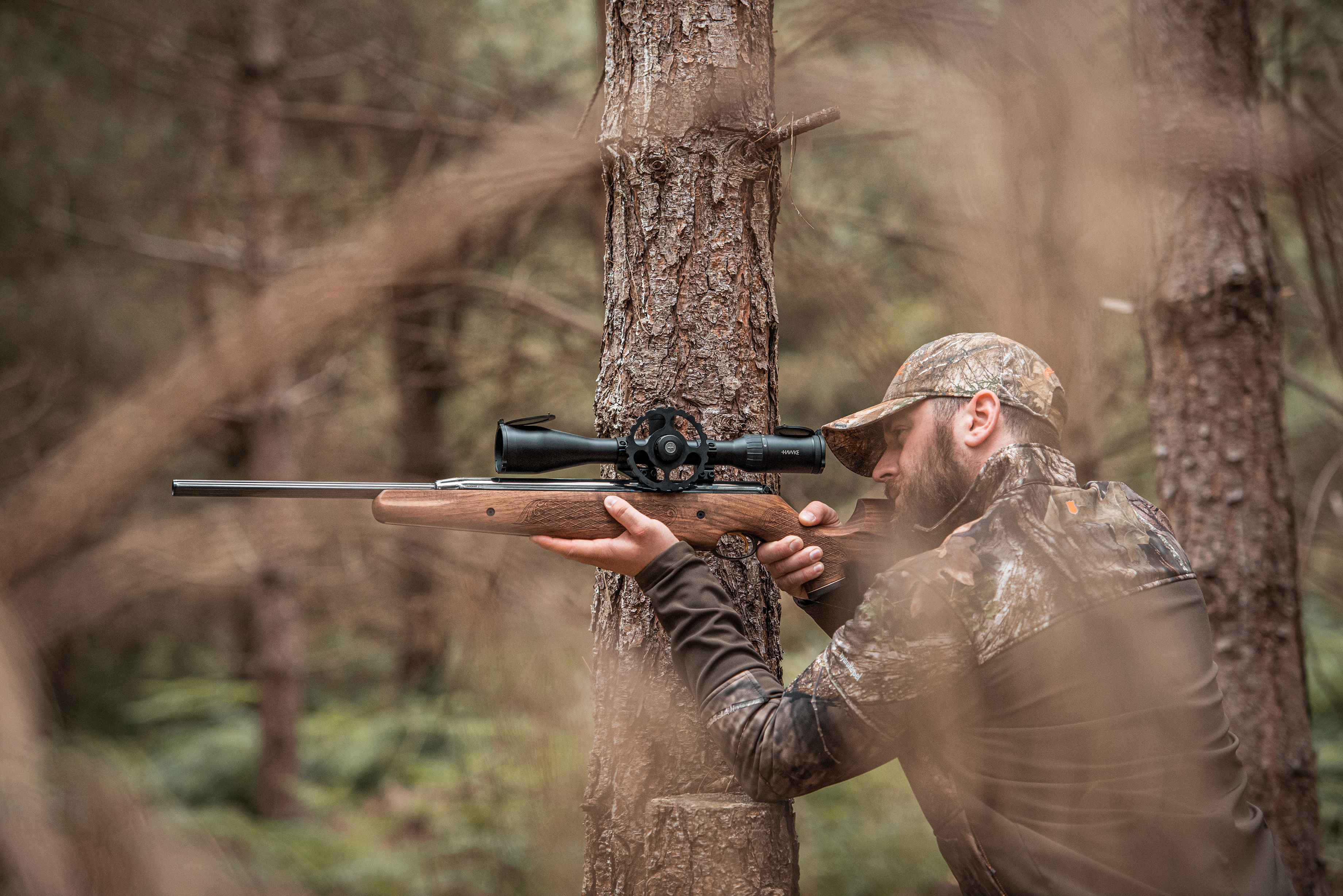Man aiming air rifle